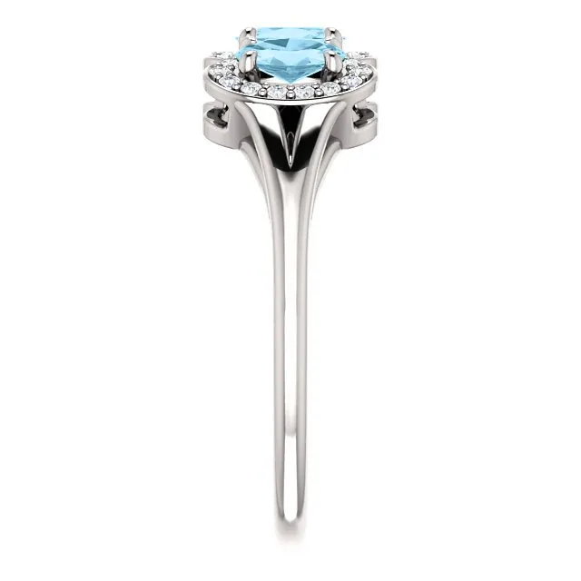 14KT GOLD .60 CTW AQUAMARINE & .16 CTW DIAMOND 3 STONE HALO RING