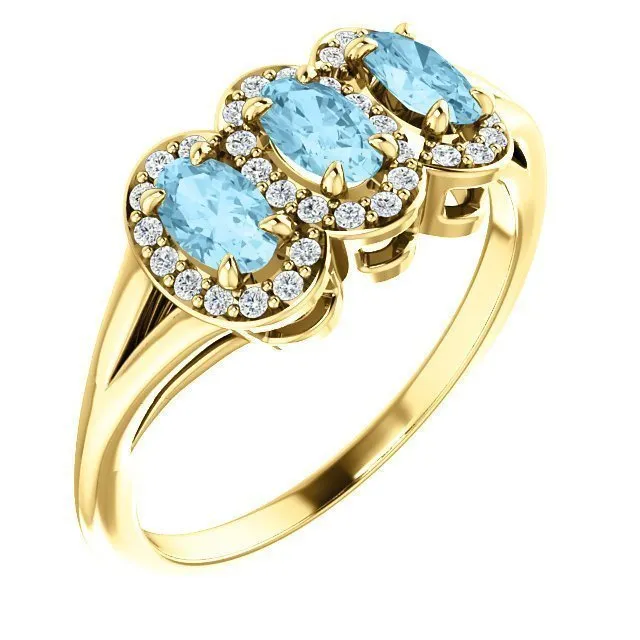 14KT GOLD .60 CTW AQUAMARINE & .16 CTW DIAMOND 3 STONE HALO RING