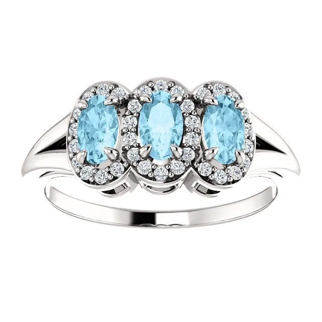 14KT GOLD .60 CTW AQUAMARINE & .16 CTW DIAMOND 3 STONE HALO RING