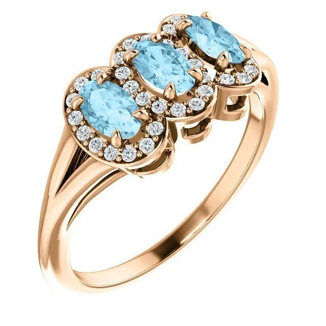 14KT GOLD .60 CTW AQUAMARINE & .16 CTW DIAMOND 3 STONE HALO RING