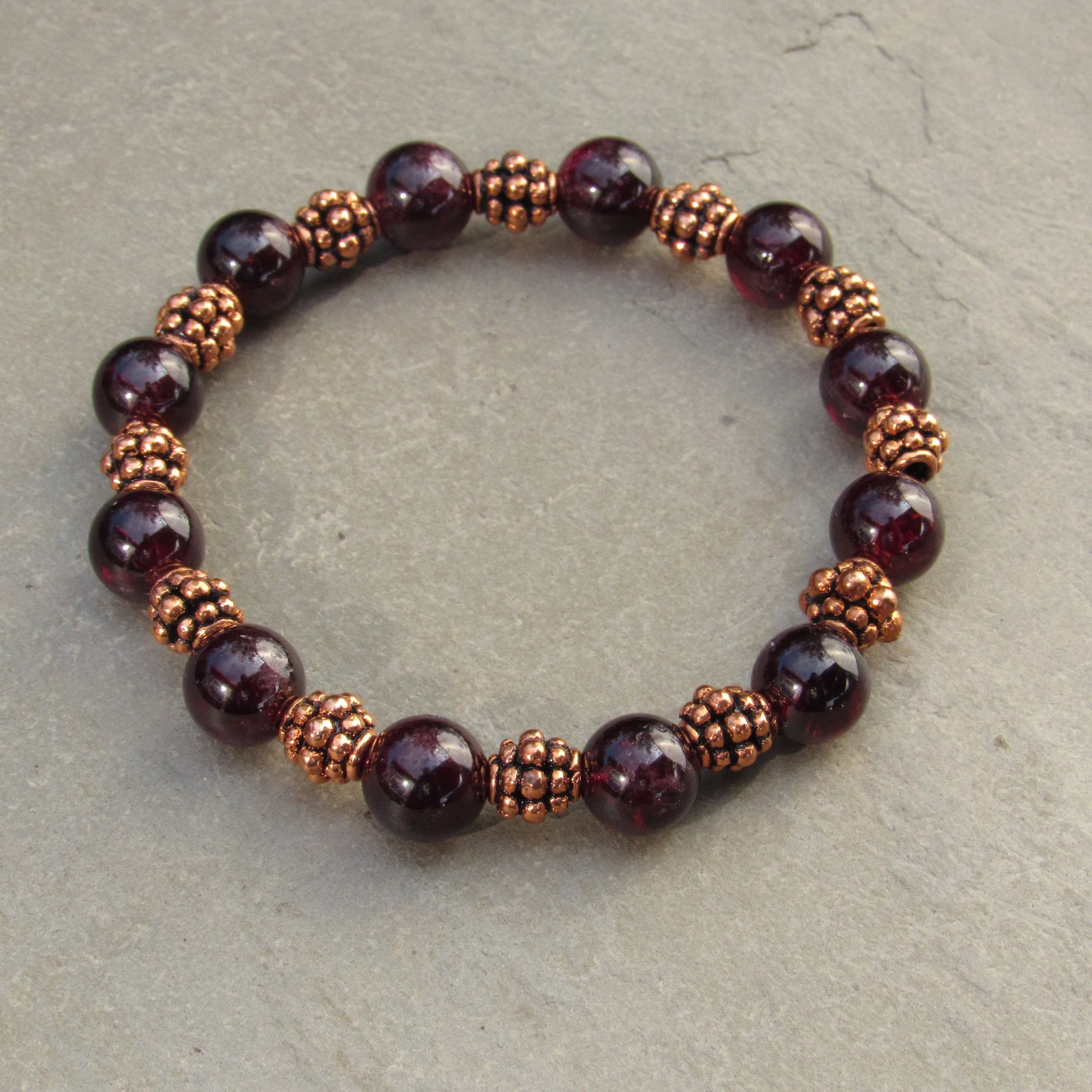 Garnet gemstones with copper stretch bracelet